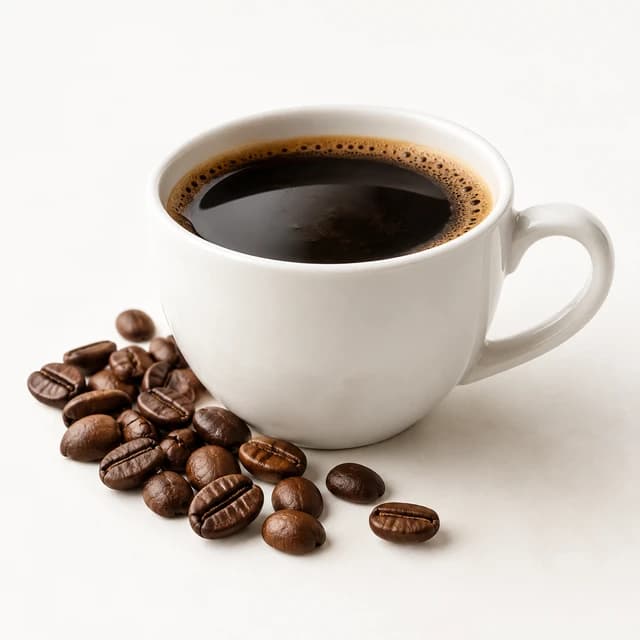 Roasted coffee beans beside brewed coffee